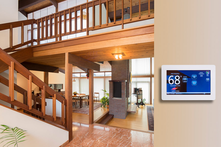 Close up shot of a wall thermostat in a wooden style home